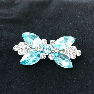 Ice Blue vintage pin set in silver metal.